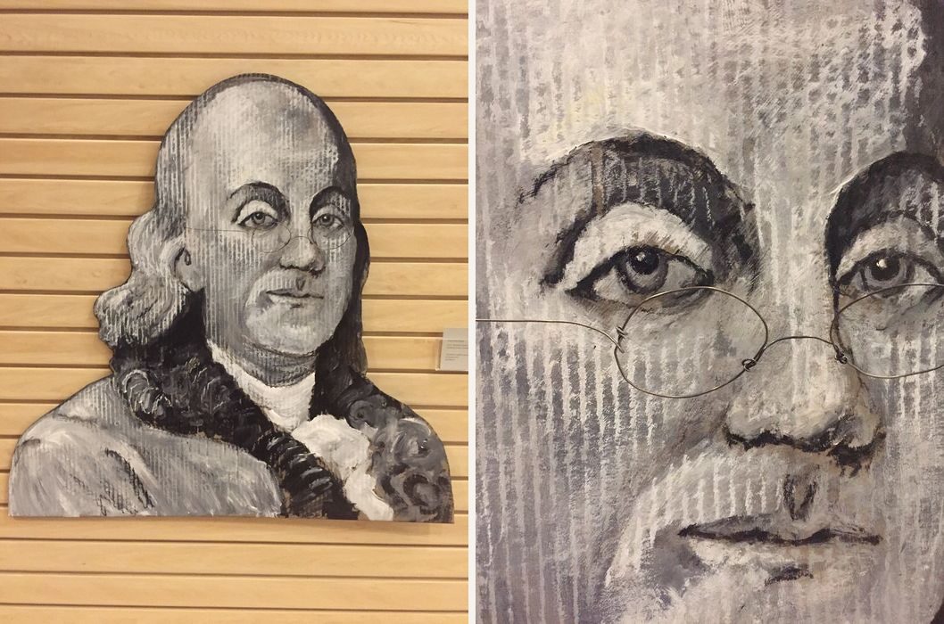 Hand-cut and hand-painted black and white portrait of Ben Franklin in wire glasses, on a wood slat wall, plus a close-up of the glasses made of real wire