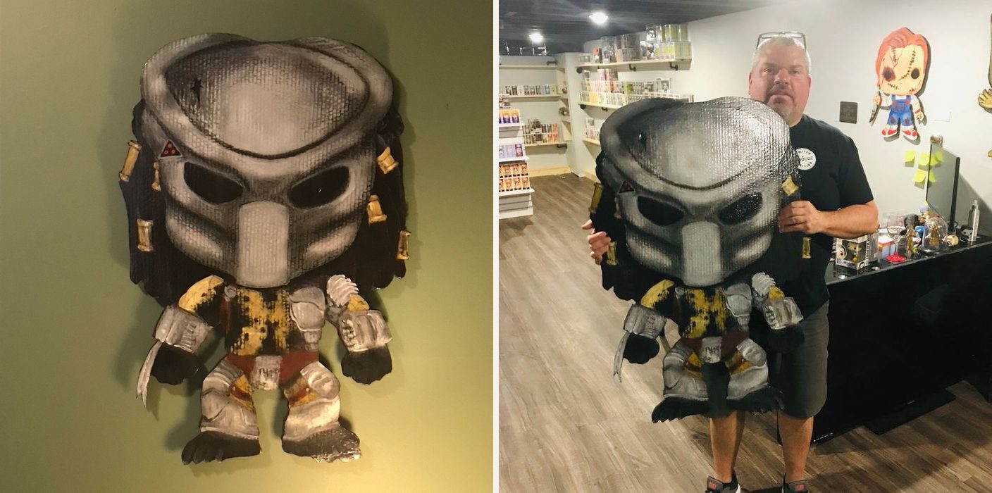 Hand-cut and hand-painted Funko Pop style Predator in a gray mask with dreadlocks and armor: on a green wall, and held by the customer in a collectibles shop