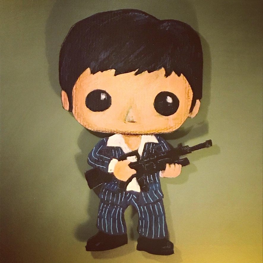 Hand-cut and hand-painted Funko Pop style Scarface in a navy pinstripe suit holding a rifle, on a green wall
