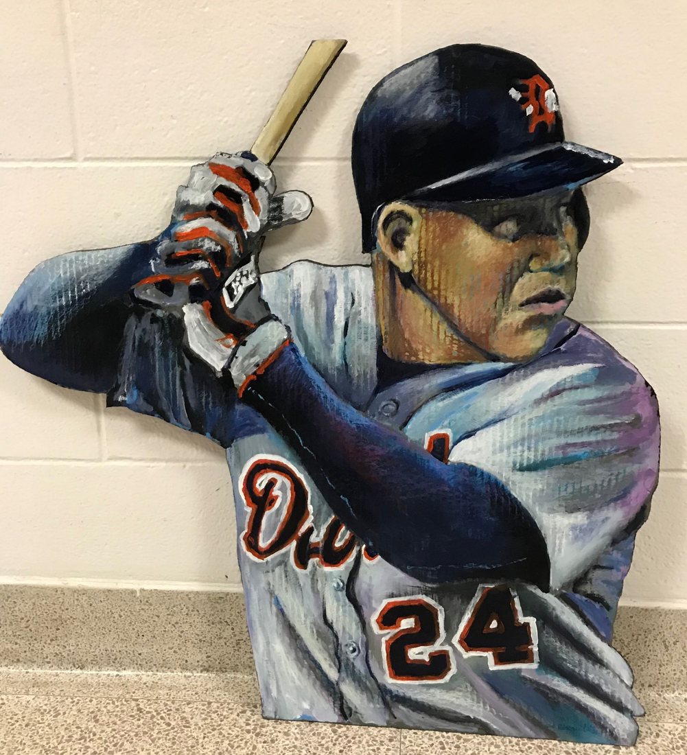 Hand-cut and hand-painted portrait of Miguel Cabrera, number 24, in a Detroit Tigers helmet and gray road jersey, swinging a bat, leaning against a wall