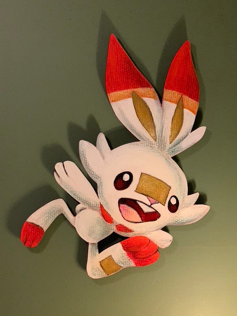 Hand-cut and hand-painted Scorbunny Pokémon cardboard cutout in white and red